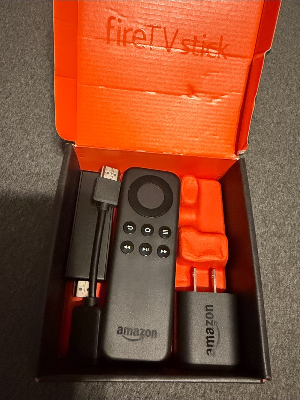 Amazon Fire TV Stick with Black Remote and Accessories